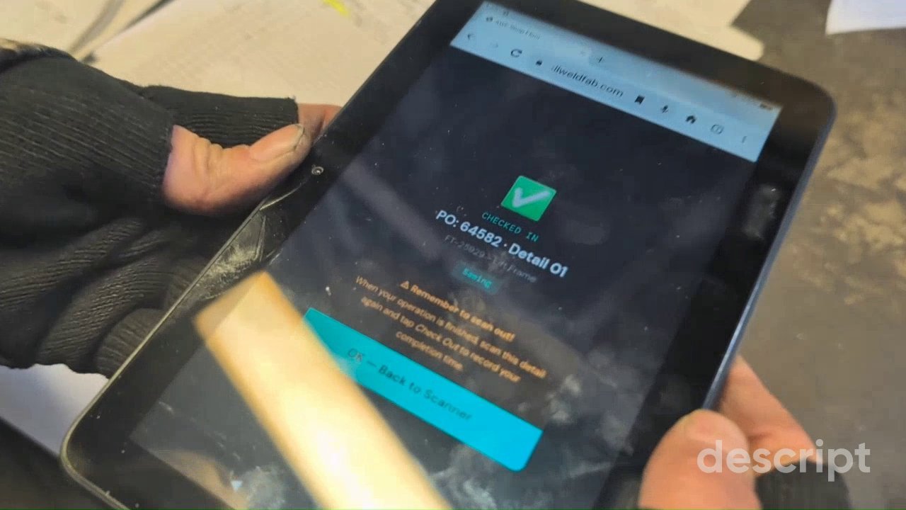 Operator scanning a QR-coded shop traveler with a $49 tablet